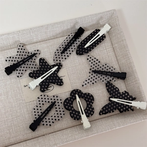 Polka dot hair clip set featuring star, flower and butterfly shapes with duckbill clips