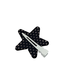 Star shaped hair clip with black and white polka dot pattern and sturdy metal base