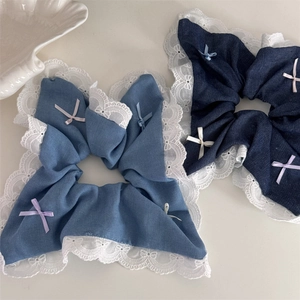 Denim fabric hair scrunchies with white lace trim and pastel ribbon bows for ponytails