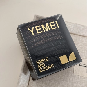 Detail of high-elasticity hair ties set in premium black translucent box packaging