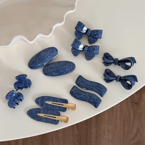 Blue denim pattern acetate hair clip set featuring bow and claw styles on white background