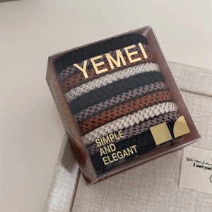 Detail of 10pcs high-elastic woven hair ties in earth tones with simple elegant packaging