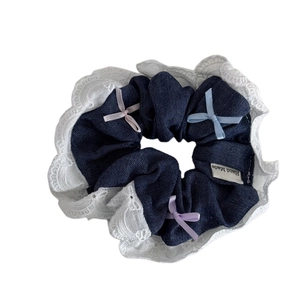 Denim hair scrunchie with white lace edges and colorful ribbon bows for women