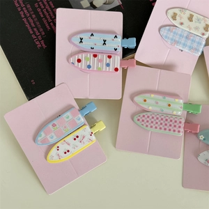 Floral and polka dot pattern macaron hair clips set for women on pink card