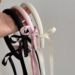 Vintage satin headband with long ribbon bows in black, pink, and beige colors