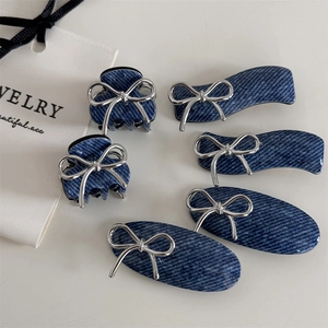 6-piece set of navy denim hair clips with silver metal bows featuring claws and flat pins