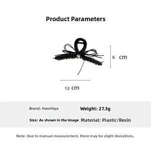 Vue détaillée d'une pince à cheveux nœud noir avec des mesures de 13cm de large et 6cm de haut