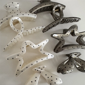 Polka dot hair claw clips set including star and bow shapes in white and grey colors