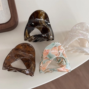 Chic acetate hair claw clips in tortoise shell and marble patterns for women styling