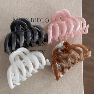 Set of four large acetate hair claw clips with elegant marble ink patterns for thick hair