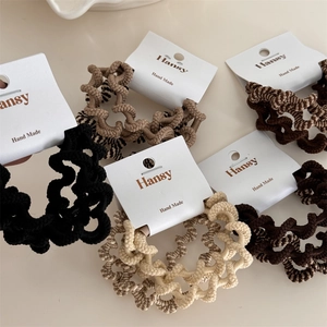 Set di 4 elastici per capelli in tessuto color terra con struttura a spirale