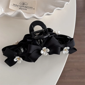 Elegant French vintage black bow hair claw clip with delicate white flowers for women