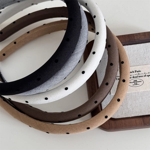 Polka dot padded headbands set in neutral tones like black grey and beige for women