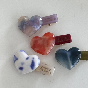 Set of four minimalist heart hair clips with marble patterns and France Handmade label