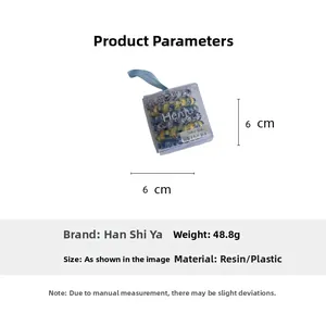 Floral print spiral hair tie set in a transparent box with blue ribbon packaging detail