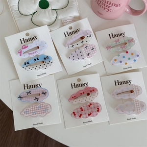 Charming cloud-shaped hair clip sets with polka dots and bows on brand cardboards