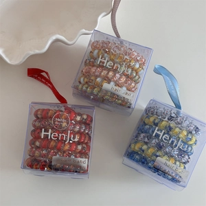 Floral spiral hair ties set in gift boxes with elegant decorative ribbons