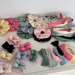 Lot de chouchous en tissu et élastiques à nœuds dans des tons pastel assortis