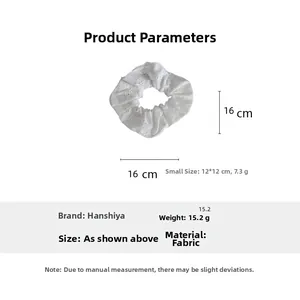 Size chart for white floral embroidery scrunchies showing large and small dimensions