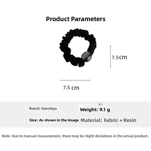 Detail of 7.5cm grey resin bead and pleated black fabric elastic hair scrunchie
