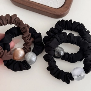 Set of 4 elastic hair scrunchies in black and coffee with marble resin beads and glitter