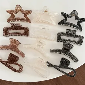 Set of twelve marble textured hair claw clips in star, square, and crescent shapes
