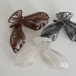 Detailed set of large hair claws with crackle texture in brown, black and white patterns