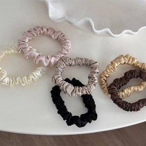 Set of 6 premium silk satin hair scrunchies in elegant neutral colors on white background