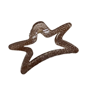 Star-shaped dark brown hair claw clip with vintage crackle pattern and gold spring