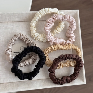 Five-piece set of pleated silk satin hair scrunchies in elegant neutral colors