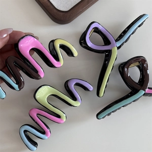 Colorful wavy hair claw clips in assorted vibrant multi-color patterns for women