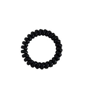 Elastic black spiral hair ties with milk polka dot design in a telephone cord style