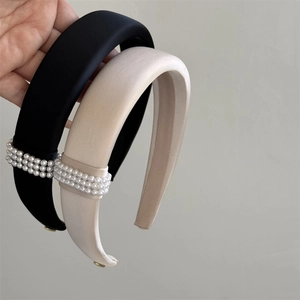 Detail showing the thick sponge headband texture with elegant pearl rows and non-slip inner teeth