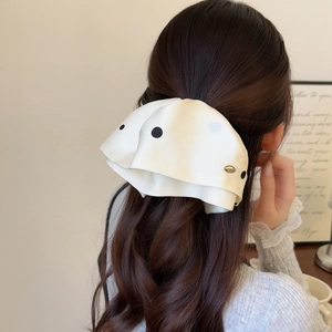 Elegant French satin polka dot scrunchie hair claw for a stylish ponytail look