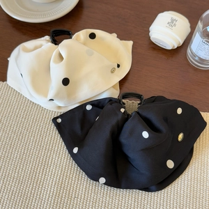 Elegant satin polka dot hair claw clip set in black and cream with pleated fabric detail