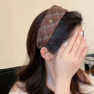 Brown plaid wide headband with gold Love metal plate for a high-volume vintage look