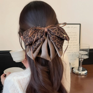 Leopard print bow hair claw clip for women in elegant high-end fashion style