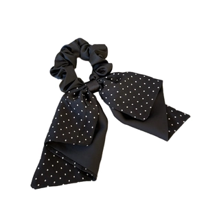 Elegant black polka dot bow scrunchie with long streamers for elegant ponytail styling