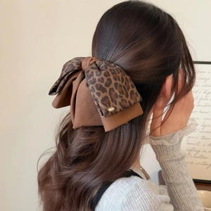 French vintage leopard print bow hair clip for women with elegant golden metal brand tag
