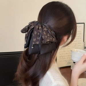 Vintage floral bow hair clip with crystal pendant for elegant half-up hairstyles