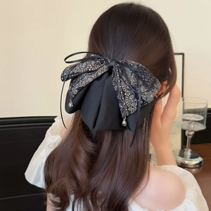 Large double-layer black bow hair clip with paisley patterns and water drop pendant