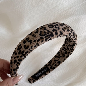 Wide pink leopard print cotton headband with handmade label for elegant hairstyling