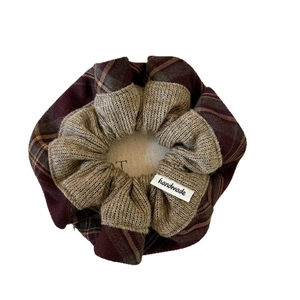 Coffee and plaid knitted hair scrunchie with handmade tag for ponytail hairstyle