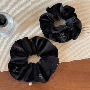 Elegant black velvet scrunchie set with silver bow prints and a white pearl pendant
