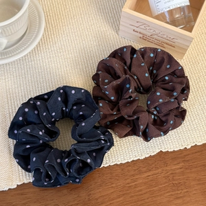 Navy and brown polka dot double-layer scrunchies with elegant pleated ruffle details