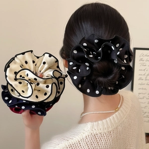 Elegant double-layered polka dot scrunchie with pleated edges for stylish buns