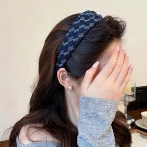 Retro navy blue checkered wide headband for women showing high skull top hair style