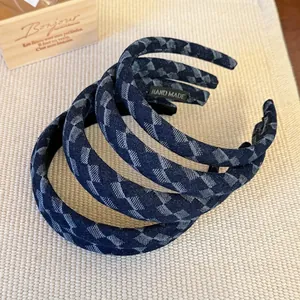 Three-piece set of navy blue denim headbands with light blue geometric diamond patterns