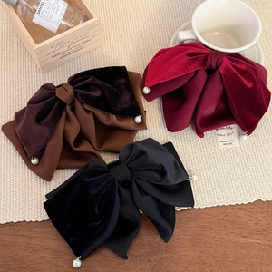 Elegant velvet and satin bow hair clips in red, black, and brown with pearl pendants