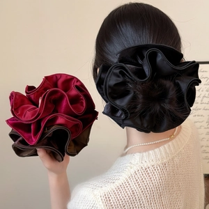 Elegant oversized velvet scrunchies in black, burgundy and brown for chic hairstyles